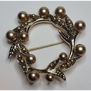 Vintage Monet Wreath Brooch With Gold Tone leaves & rounded bead-like elements